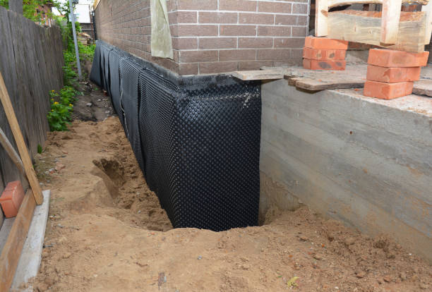 Happy homeowners after waterproofing job in Hilltown